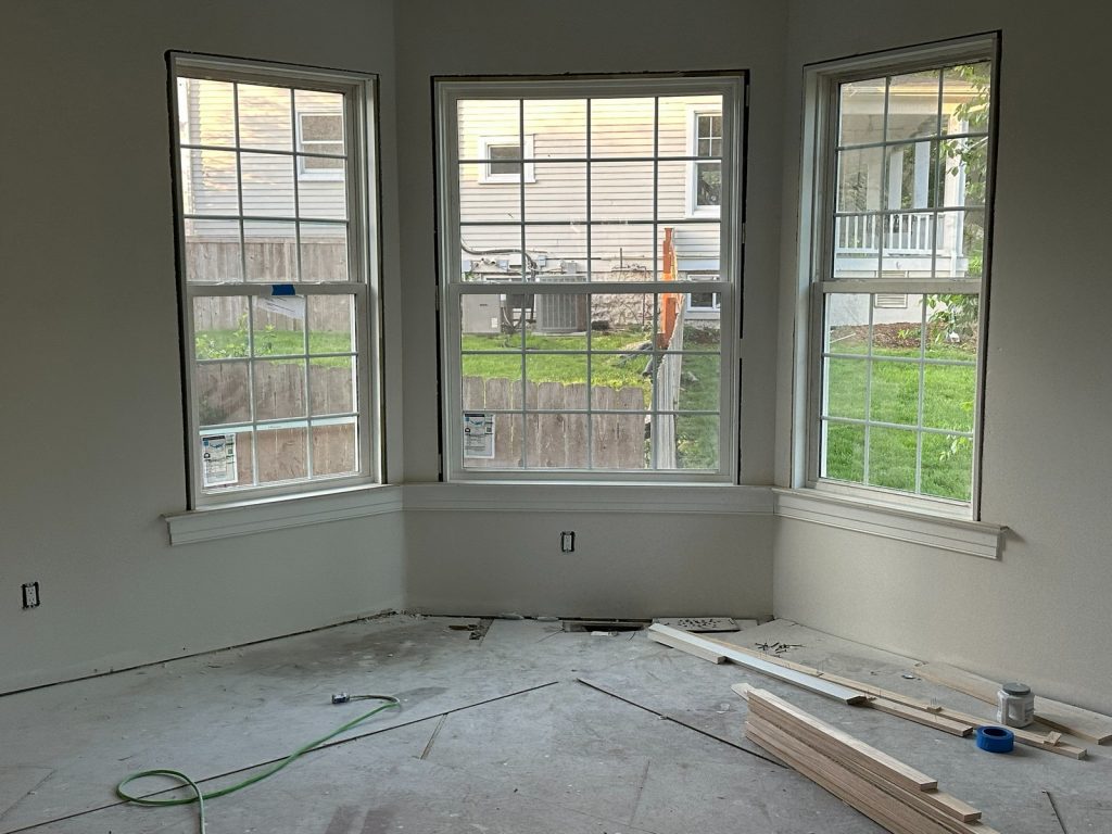 New bay window framed and drywalled, ready for flooring