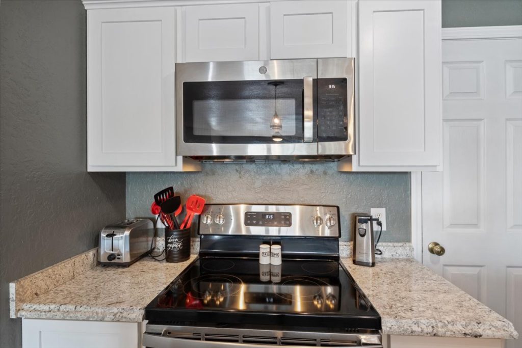 Kitchen with stainless range and microwave