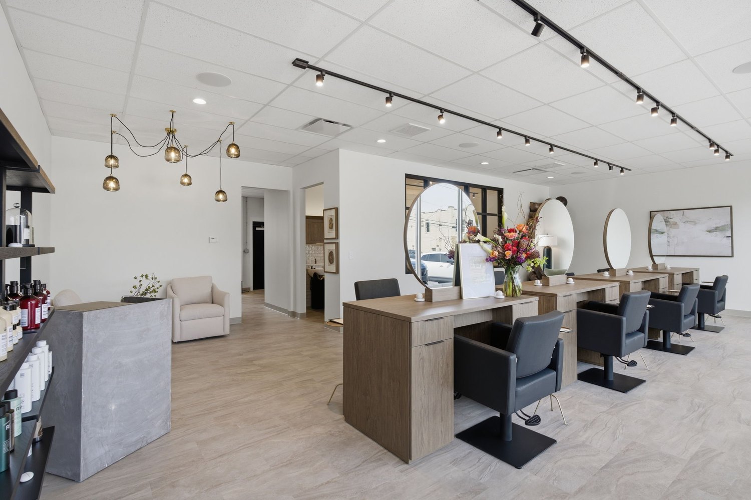Completed salon build-out with track lighting and custom millwork