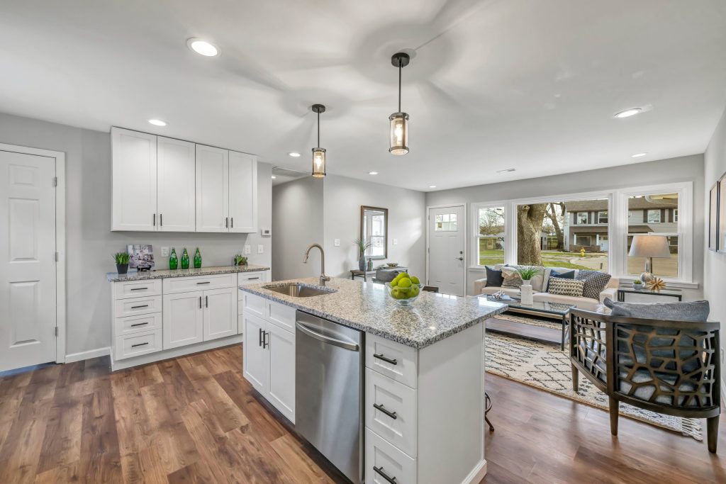 Kitchen island with granite top open to the living room