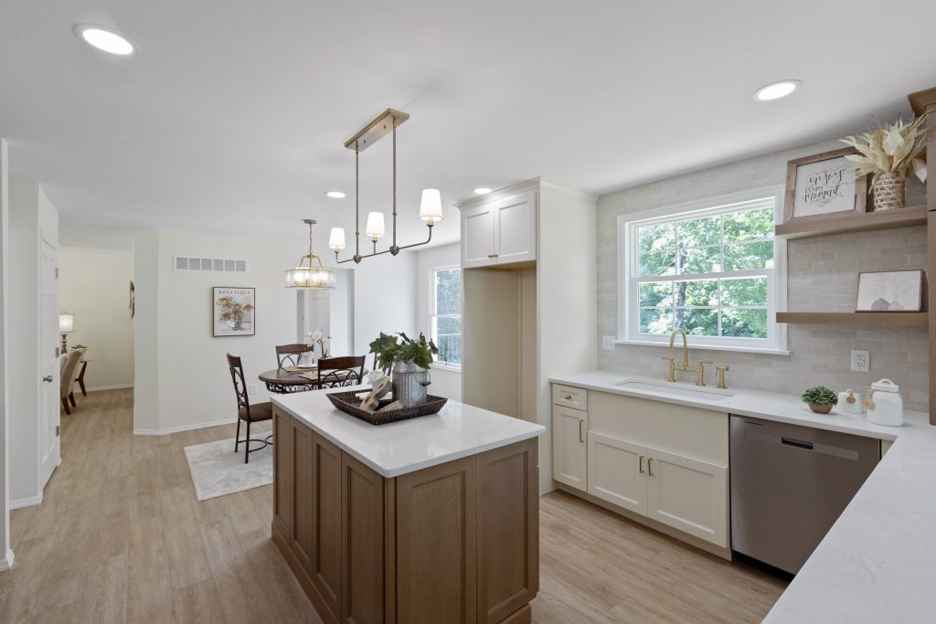 Kitchen with wood island, chandelier and stainless dishwasher