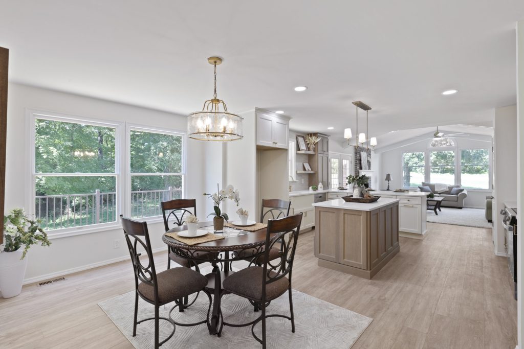 Dining area with chandelier and kitchen beyond