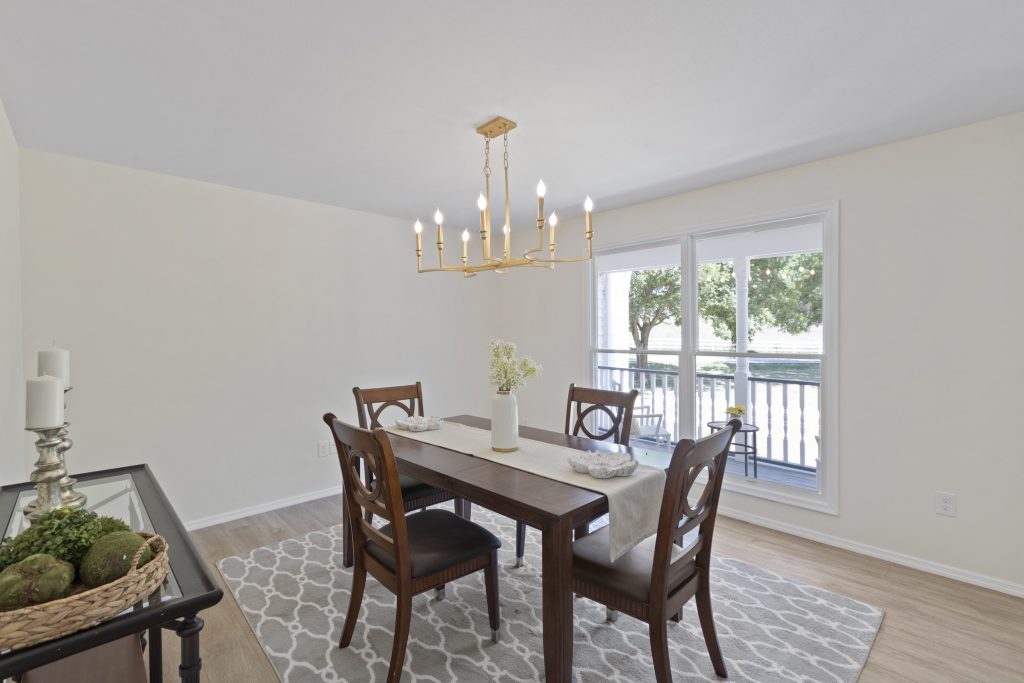 Dining room with chandelier and patio doors