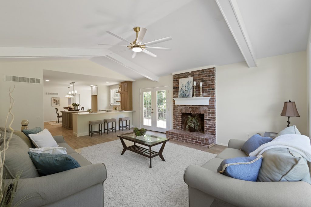 Family room with brick fireplace and breakfast bar beyond