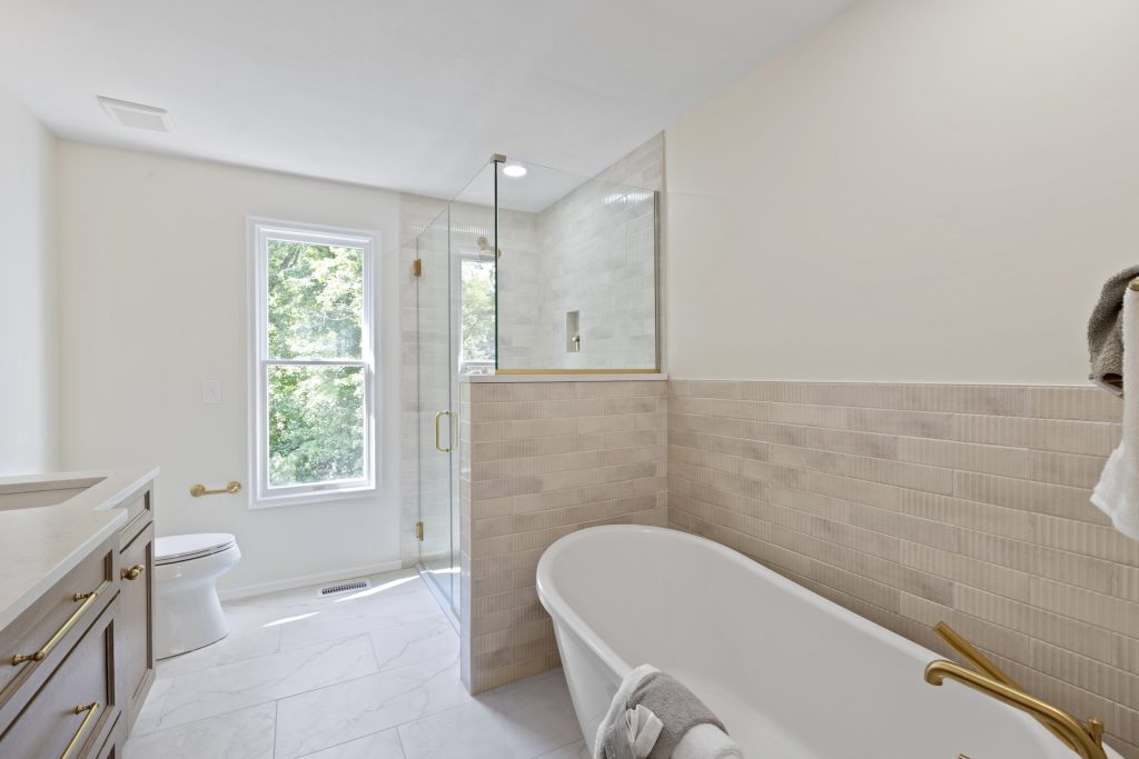 Bathroom with freestanding tub and glass shower