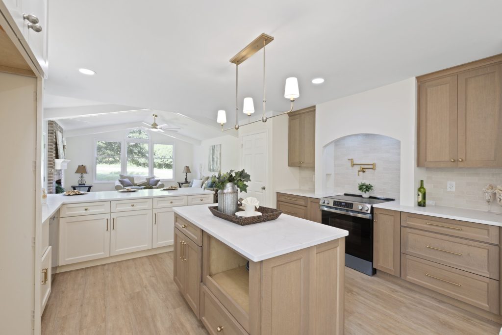 Kitchen with wood island and range beyond
